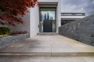 Modern entrance with stone pathway.